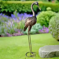 Héron décoratif en métal 107cm ailes repliées - Bronze brossé