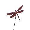 Silhouette libellule sur tige en métal rouillé